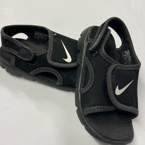 Nike toddler/baby sandals, size 7, used but decent condition. Color is black.